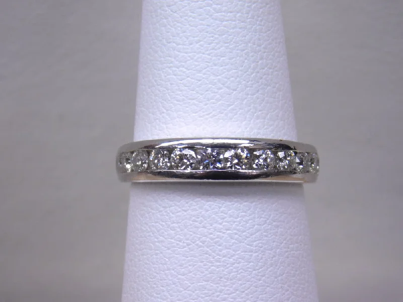 Women’s handmade rings-ESTATE PLATINUM .75 CT CHANNEL SET BAND