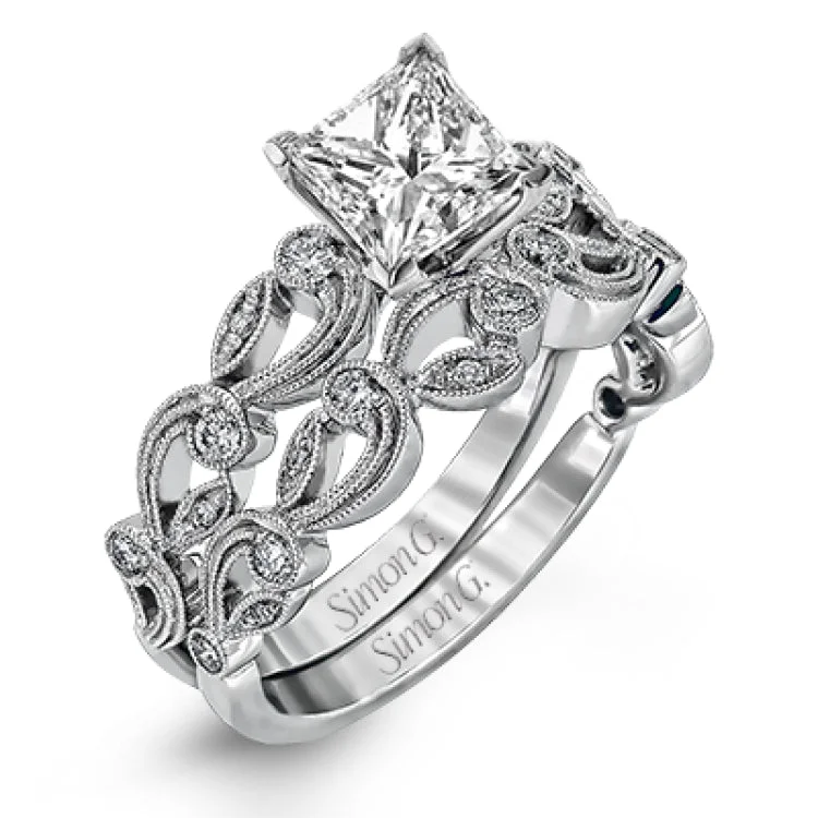 Women's radiant cut engagement rings with diamonds-This delicate floral inspired white gold engagement ring and wedding band set is accentuated with .28 ctw shimmering round cut white diamonds.