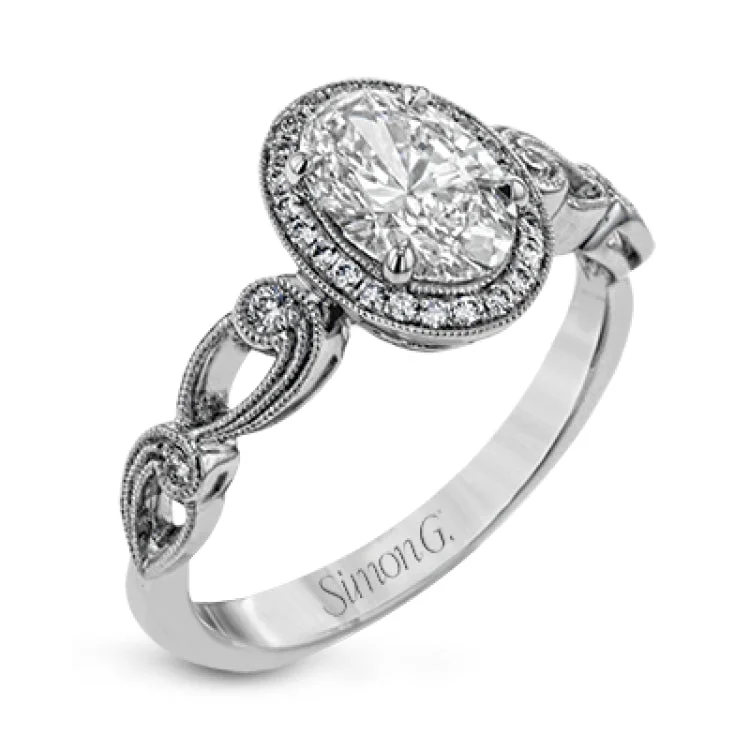 Women's oval-cut sapphire engagement rings-Reflecting a lovely romantic design, this white gold classic engagement ring features .16 ctw round cut white diamond accents.