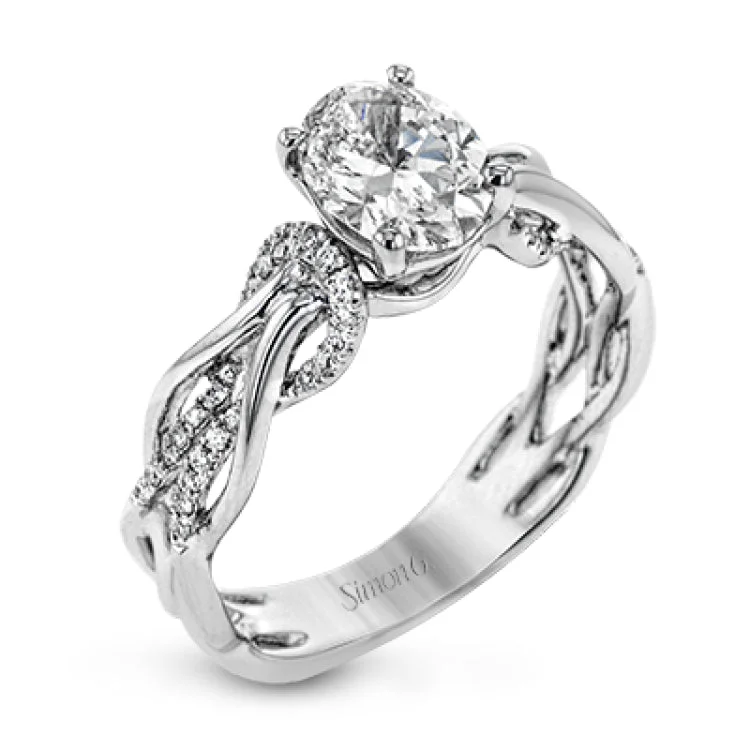 Women's diamond accent engagement rings-This impressive contemporary white engagement ring features a unique twisting design on the shank, which is complemented by .17 ctw of round cut white diamonds.