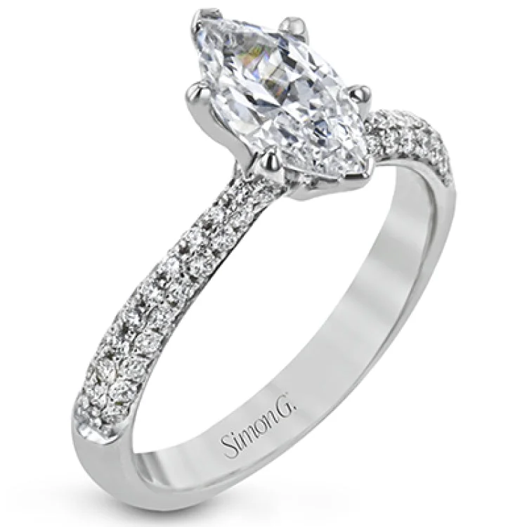 Women's colored diamond engagement rings-The classic design of this white gold engagement ring and wedding band set is emphasized by .72 ctw round cut white diamonds.