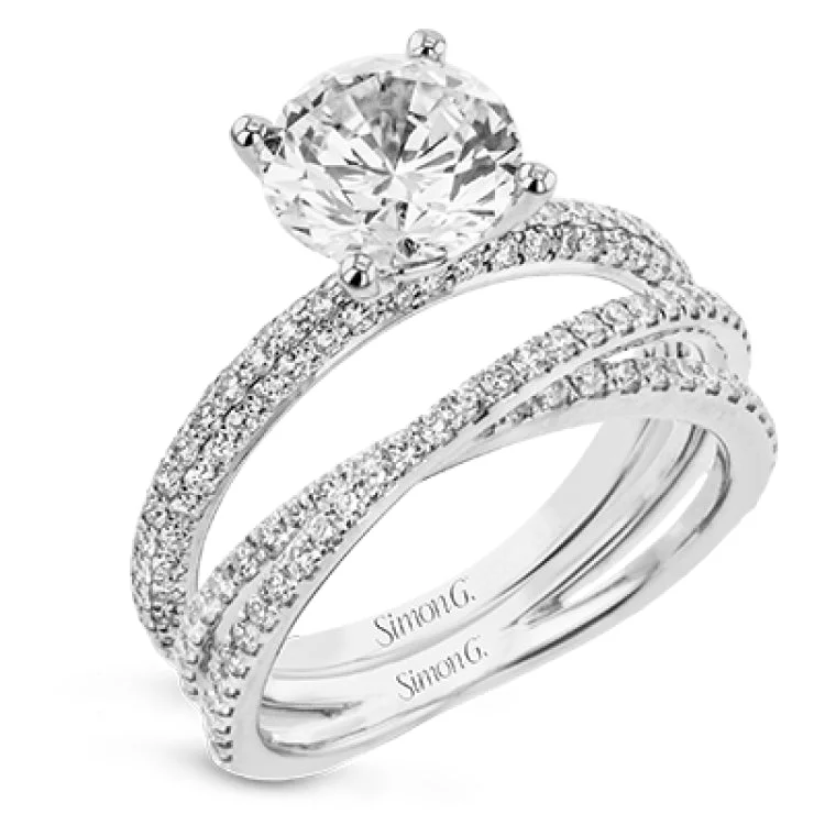 Women's radiant cut engagement rings-Sophisticated and glamorous, this white gold engagement ring's halo and sides feature .65 ctw of round white diamonds as well as .42 ctw of white diamond side stones.