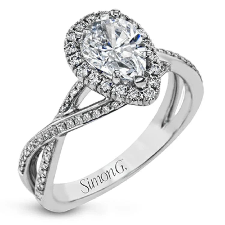 Women's oval-cut sapphire engagement rings-This sparkling modern engagement ring features an eye-catching twisted design with elegant classic halo accented by .29 ctw of shimmering round cut white diamonds.