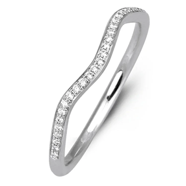 Women's diamond engagement rings-This sparkling modern white gold engagement ring and wedding band set features an eye-catching twisted design accented by .22 ctw of shimmering round cut white diamonds.