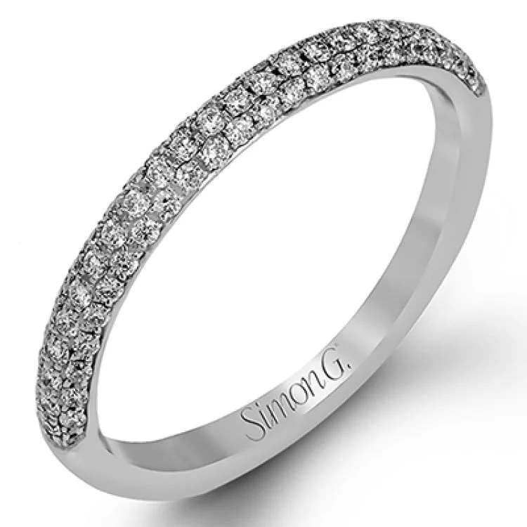 Women's classic engagement rings-The classic design of this white gold engagement ring and wedding band set is emphasized by .72 ctw round cut white diamonds.