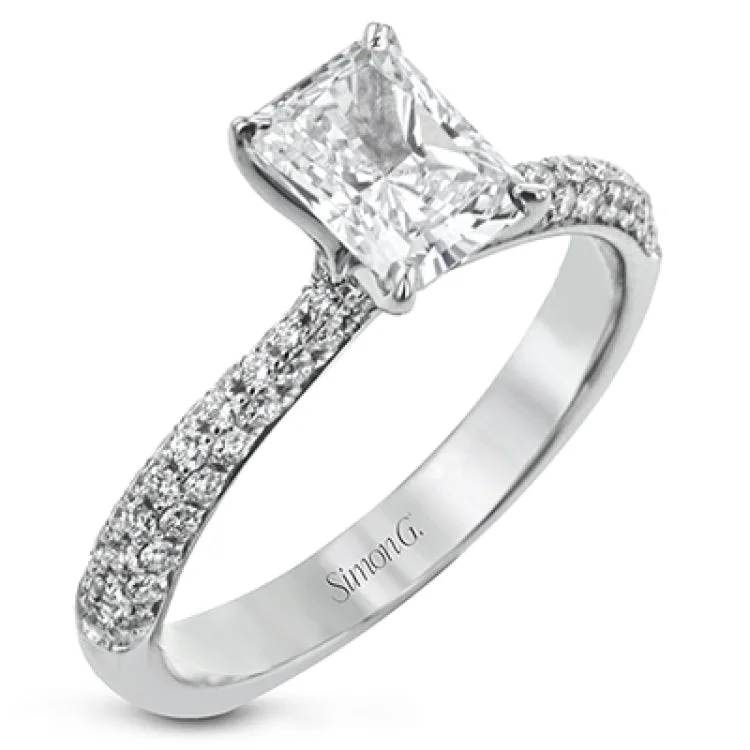 Women's custom engagement rings-The classic design of this white gold engagement ring and wedding band set is emphasized by .72 ctw round cut white diamonds.