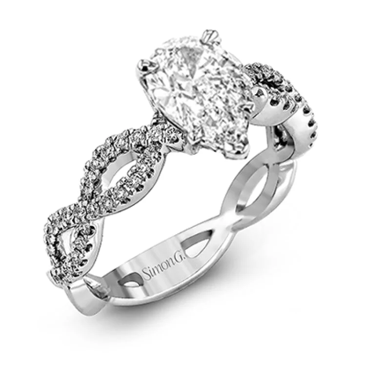 Women's engagement rings with diamonds-The intricate twisted design of this modern white gold engagement ring and wedding band set is set with .65 ctw of striking round cut white diamonds.