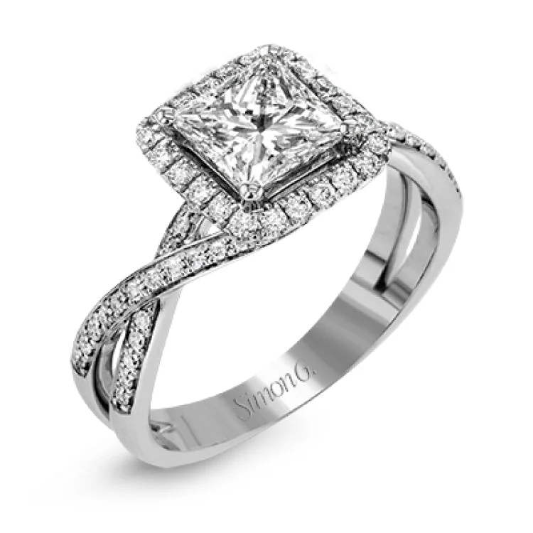 Women's custom engagement rings-This sparkling modern engagement ring features an eye-catching twisted design with elegant classic halo accented by .29 ctw of shimmering round cut white diamonds.