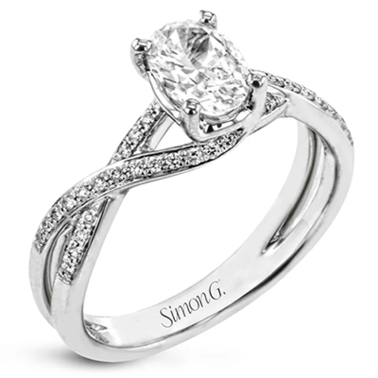 Women's platinum diamond engagement rings-This sparkling modern white gold engagement ring and wedding band set features an eye-catching twisted design accented by .22 ctw of shimmering round cut white diamonds.