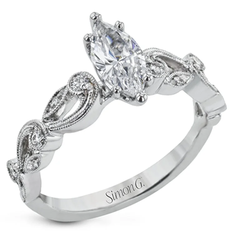 Women's solitaire engagement rings with side diamonds-This delicate floral inspired white gold engagement ring and wedding band set is accentuated with .28 ctw shimmering round cut white diamonds.