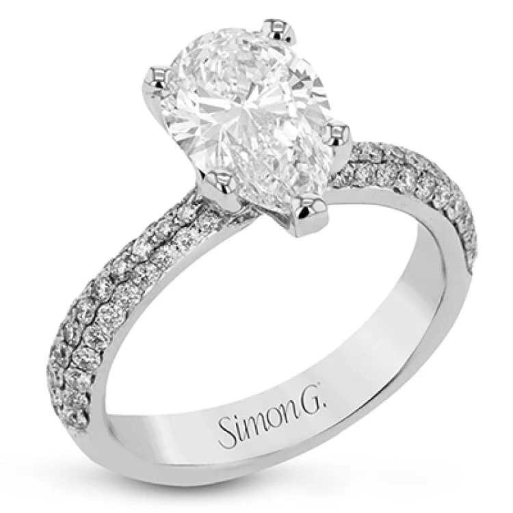 Women's gold engagement rings-The classic design of this white gold engagement ring and wedding band set is emphasized by .72 ctw round cut white diamonds.