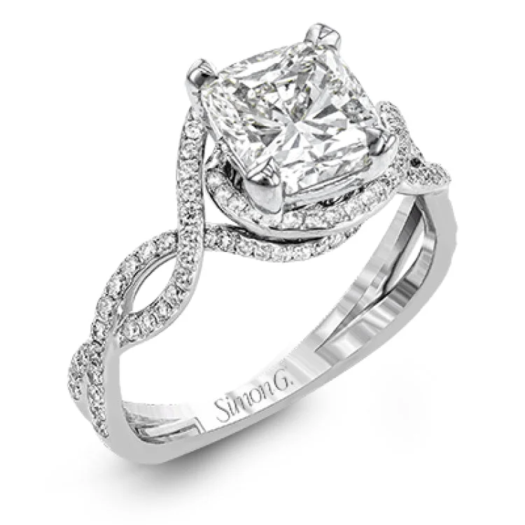 Women's round diamond engagement rings-Classic with a modern twist, this white gold engagement ring features .50 ctw of sparkling white diamonds in a dramatic openwork design.