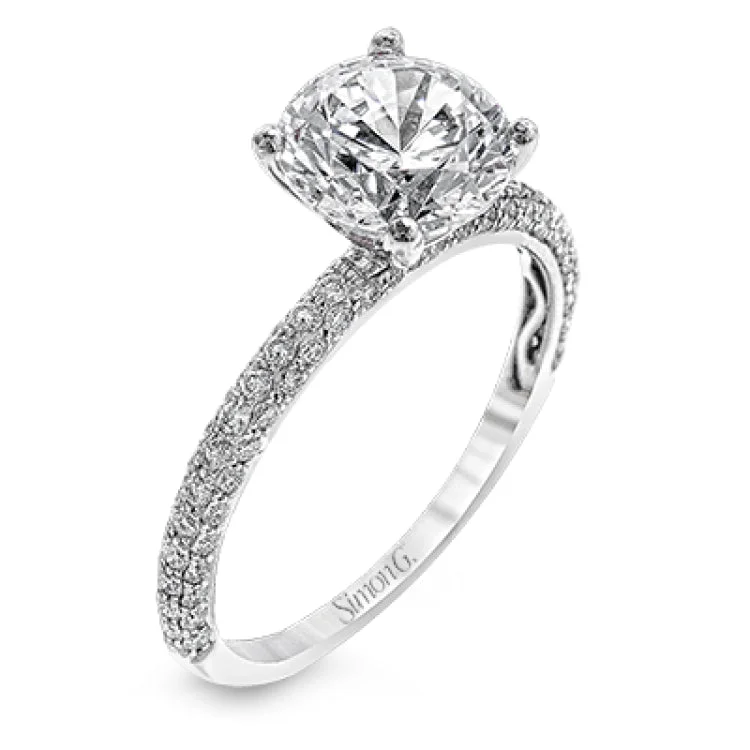 Women's platinum solitaire engagement rings-Sophisticated and glamorous, this white gold engagement ring's halo and sides feature .65 ctw of round white diamonds as well as .42 ctw of white diamond side stones.