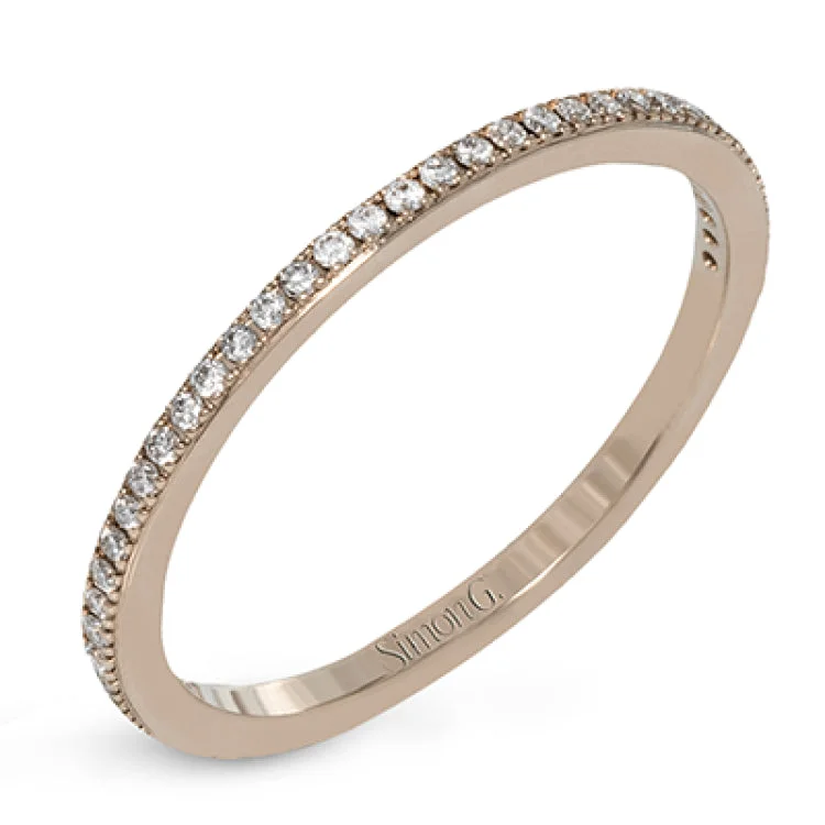 Women's minimalist engagement rings-The classic, streamlined design of this 18k rose gold wedding set is accented by .30 ctw of sparkling white round brilliant diamonds.