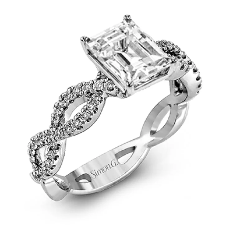 Women's luxury engagement rings-The intricate twisted design of this modern white gold engagement ring and wedding band set is set with .65 ctw of striking round cut white diamonds.