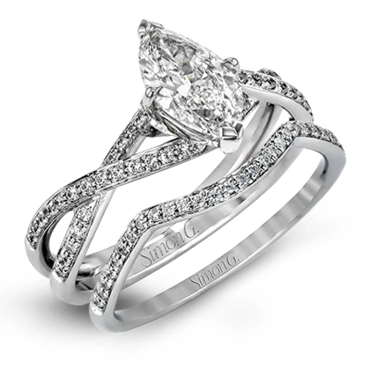 Women's antique engagement rings-This sparkling modern white gold engagement ring and wedding band set features an eye-catching twisted design accented by .22 ctw of shimmering round cut white diamonds.