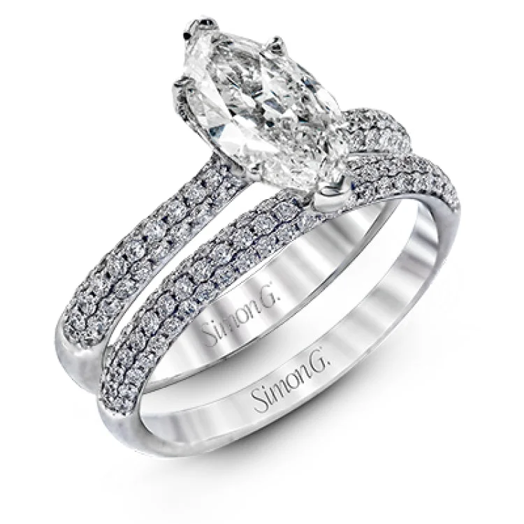 Women's white gold engagement rings-The classic design of this white gold engagement ring and wedding band set is emphasized by .72 ctw round cut white diamonds.