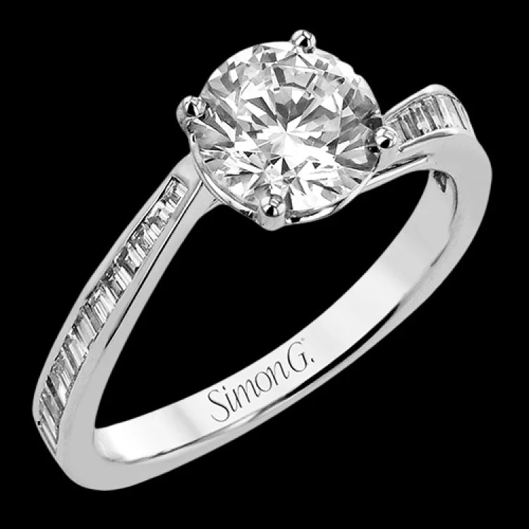 Women's vintage-inspired engagement rings-This engagement ring in 18 kt white gold has a gentle curved band of sparkling baguettes 0.39 ctw.